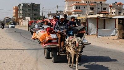 Palestinians make their way to flee their homes, after the Israel army issued evacuation orders for Rafah. (REUTERS)