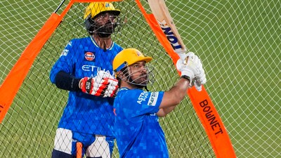 CSK's MS Dhoni bats as teammate Ravindra Jadeja looks on during a training session ahead of IPL 2025 match against MI (PTI) CSK's MS Dhoni bats as teammate Ravindra Jadeja looks on during a training session ahead of IPL 2025 match against MI (PTI)