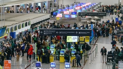 Travelers at the Hartsfield-Jackson Atlanta International Airport (ATL) in Atlanta, Georgia. (Bloomberg) Travelers at the Hartsfield-Jackson Atlanta International Airport (ATL) in Atlanta, Georgia. (Bloomberg)