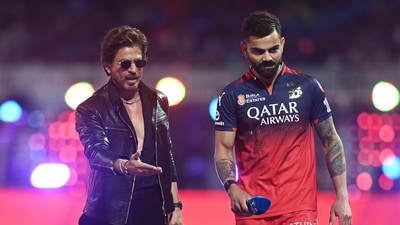 Royal Challengers Bangalore's Virat Kohli with Shah Rukh Khan before the first IPL match this season on Saturday. (REUTERS)