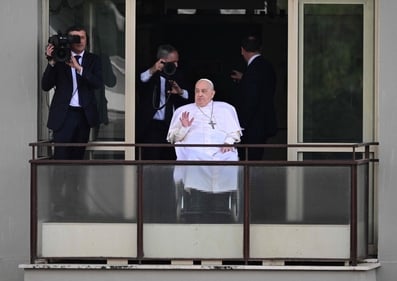 Pope Francis waves from a window of the Gemelli hospital before being discharged following a five weeks hospitalization for pneumonia, in Rome on March 23, 2025. (AFP) Pope Francis waves from a window of the Gemelli hospital before being discharged following a five weeks hospitalization for pneumonia, in Rome on March 23, 2025. (AFP)