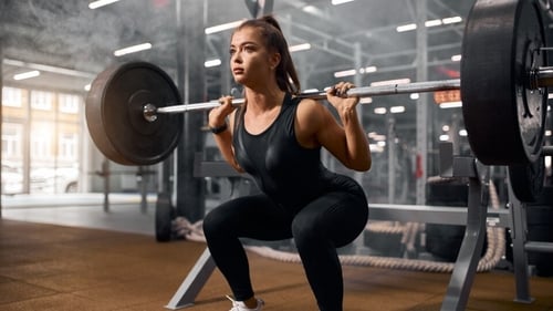 According to a fitness coach, weighted squats and incline walking can help you reduce belly fat. (Shutterstock) According to a fitness coach, weighted squats and incline walking can help you reduce belly fat. (Shutterstock)