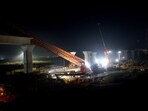 Restoration work underway after a segmental launching gantry (crane) skidded and fell near Vatva-Ropda Road, in Ahmedabad
