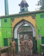 Police constables guarding the gate of the dargah in Prayagraj on Sunday (Anil Kumar Maurya/HT) Police constables guarding the gate of the dargah in Prayagraj on Sunday (Anil Kumar Maurya/HT)