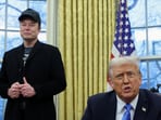 US President Donald Trump speaks next to Elon Musk and X Æ A-12, Musk's son, in the Oval Office of the White House in Washington.