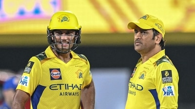 CSK's Rachin Ravindra (L) and MS Dhoni look on during the IPL 2025 match between Chennai Super Kings and Mumbai Indians (AFP)