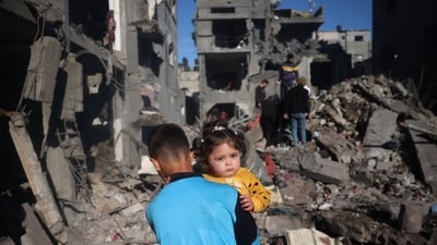 Palestinian children react as they inspect the rubble and debris at the site of Israeli strikes the night before at the Nuseirat refugee camp in the central Gaza Strip on March 23, 2025. The Israeli military has urged residents of the southern Gaza city of Rafah to evacuate as forces launched an offensive against militants in the area. (AFP) Palestinian children react as they inspect the rubble and debris at the site of Israeli strikes the night before at the Nuseirat refugee camp in the central Gaza Strip on March 23, 2025. The Israeli military has urged residents of the southern Gaza city of Rafah to evacuate as forces launched an offensive against militants in the area. (AFP)