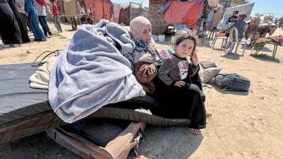 Palestinians prepare to set out to Khan Yunis with their belongings, from Rafah's Tel al-Sultan area after it was encircled by Israeli forces. (AFP) Palestinians prepare to set out to Khan Yunis with their belongings, from Rafah's Tel al-Sultan area after it was encircled by Israeli forces. (AFP)
