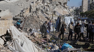 Palestinians inspect the site hit by an Israeli bombardment, in Gaza City on Sunday, March 23, 2025. (AP) Palestinians inspect the site hit by an Israeli bombardment, in Gaza City on Sunday, March 23, 2025. (AP)