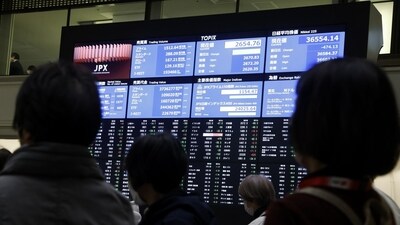 Visitors in front of an electronic stock board at the Tokyo Stock Exchange (TSE) in Tokyo, Japan, on Tuesday, March 11, 2025. (Kiyoshi Ota/Bloomberg) Visitors in front of an electronic stock board at the Tokyo Stock Exchange (TSE) in Tokyo, Japan, on Tuesday, March 11, 2025. (Kiyoshi Ota/Bloomberg)