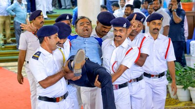 A BJP MLA being evicted by Marshals during the Budget session of Karnataka assembly on March 21. Eighteen BJP MLAs were suspended for six months for "disrespecting" Speaker U T Khader. (PTI file photo) A BJP MLA being evicted by Marshals during the Budget session of Karnataka assembly on March 21. Eighteen BJP MLAs were suspended for six months for "disrespecting" Speaker U T Khader. (PTI file photo)