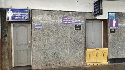 Passengers forced to sit on platform floors due to inadequate seating arrangements, toilet is closed and battery-operated electric vehicles lie unused at the Pune railway station. (HT) Passengers forced to sit on platform floors due to inadequate seating arrangements, toilet is closed and battery-operated electric vehicles lie unused at the Pune railway station. (HT)