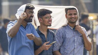 People protect themselves from the heat in Mumbai. (PTI Photo) People protect themselves from the heat in Mumbai. (PTI Photo)