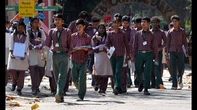 Students coming out of examination centre after appearing for their exam at Government Senior Secondary Smart School, PAU in Ludhiana on Monday. (Manish/HT)