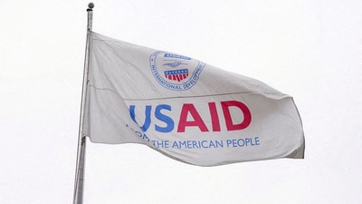 A USAID flag flutters outside, as the USAID building sits closed to employees after a memo was issued advising agency personnel to work remotely, in Washington on February 3. (Reuters)