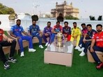 Teams of all IPL teams pose for a photograph with trophy 