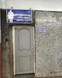 Passengers forced to sit on platform floors due to inadequate seating arrangements, toilet is closed and battery-operated electric vehicles lie unused at the Pune railway station. (HT)