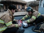 Firefighters gather ahead of the approaching wildfire in Andong Hahoe Folk Village, in Andong, South Korea, on March 25, 2025. Inhabitants of a UNESCO-listed village were ordered to evacuate while a historic Buddhist temple was burned to the ground as South Korea scrambled to contain worsening wildfires, which are tearing across the country's southeast. Firefighters gather ahead of the approaching wildfire in Andong Hahoe Folk Village, in Andong, South Korea, on March 25, 2025. Inhabitants of a UNESCO-listed village were ordered to evacuate while a historic Buddhist temple was burned to the ground as South Korea scrambled to contain worsening wildfires, which are tearing across the country's southeast.