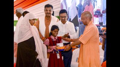 Chief minister Yogi Adityanath during the inauguration of an exhibition based on public welfare schemes on the completion of 8 years of the state government, in Gorakhpur. (@CMOfficeUP via PTI Photo)