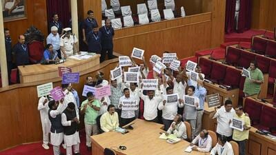 Congress and BJD MLAs stage a protest in the House during the Budget session of Odisha assembly in Bhubaneswar on Tuesday (PTI) Congress and BJD MLAs stage a protest in the House during the Budget session of Odisha assembly in Bhubaneswar on Tuesday (PTI)