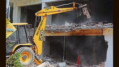 Demolition work underway by LDA at an illegal construction site of Yajdan builder, near Balu Adda, in Lucknow, Uttar Pradesh, India, on Wednesday, March 30, 2022. (Deepak Gupta/Hindustan Times)