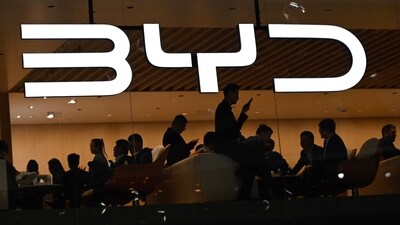 The BYD logo is displayed at the Beijing Auto Show on April 25, 2024. Chinese battery and carmaker BYD saw a surge in revenue last year, a stock filing showed on March 24, 2025, surpassing the $100 billion mark and beating rival Tesla as the Shenzhen-based firm accelerates its overseas expansion. (Pedro Pardo/AFP) The BYD logo is displayed at the Beijing Auto Show on April 25, 2024. Chinese battery and carmaker BYD saw a surge in revenue last year, a stock filing showed on March 24, 2025, surpassing the $100 billion mark and beating rival Tesla as the Shenzhen-based firm accelerates its overseas expansion. (Pedro Pardo/AFP)