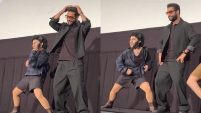 Jr NTR and his fan who dressed like him danced at the screening of Devara. Jr NTR and his fan who dressed like him danced at the screening of Devara.