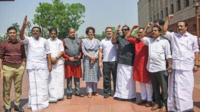 Lok Sabha LoP and Congress MP Rahul Gandhi (centre) along with party MPs Priyanka Gandhi Vadra, KC Venugopal, Shashi Tharoor and other opposition members, protest over the MNREGA issue at Parliament on Tuesday. (ANI Photo) Lok Sabha LoP and Congress MP Rahul Gandhi (centre) along with party MPs Priyanka Gandhi Vadra, KC Venugopal, Shashi Tharoor and other opposition members, protest over the MNREGA issue at Parliament on Tuesday. (ANI Photo)