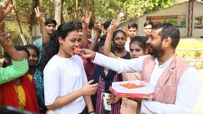 Students celebrate by sharing sweets after BSEB declared the Class 12 Results (Santosh Kumar)