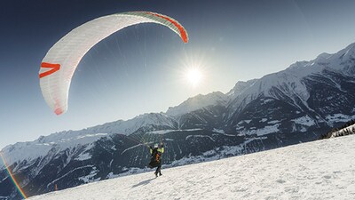 Paragliding over the glacier: For an unforgettable adventure, thrill-seekers can soar over the Great Aletsch Glacier on a tandem paragliding flight and enjoy the bird-eye’s view of the glacier and neighbouring peaks. Paragliding over the glacier: For an unforgettable adventure, thrill-seekers can soar over the Great Aletsch Glacier on a tandem paragliding flight and enjoy the bird-eye’s view of the glacier and neighbouring peaks.