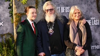 (L/R) British actor Bella Ramsey, Argentine composer Gustavo Santaolalla and his wife Alejandra Palacios attend the premiere of HBO's "The Last of Us", Season 2, at the TCL Chinese theatre in Hollywood, California, March 24, 2025. (Photo by Chris DELMAS / AFP) (AFP) (L/R) British actor Bella Ramsey, Argentine composer Gustavo Santaolalla and his wife Alejandra Palacios attend the premiere of HBO's "The Last of Us", Season 2, at the TCL Chinese theatre in Hollywood, California, March 24, 2025. (Photo by Chris DELMAS / AFP) (AFP)