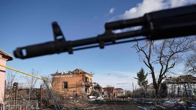 Russian soldiers walk past destroyed houses in the village of Kazachya Loknya in the Sudzha district of the Kursk region on March 18, 2025, (AFP) Russian soldiers walk past destroyed houses in the village of Kazachya Loknya in the Sudzha district of the Kursk region on March 18, 2025, (AFP)