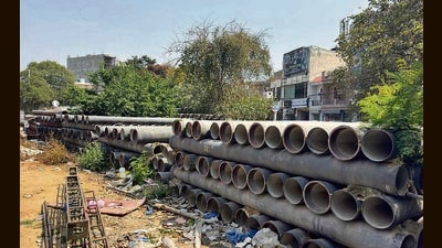 Water pipes, purchased in 2021 under the Smart City Mission, lying on the Ramleela ground near mandir situated in Sarabha Nagar area in Ludhiana on Tuesday. (Gurpreet Singh/Hindustan Times) Water pipes, purchased in 2021 under the Smart City Mission, lying on the Ramleela ground near mandir situated in Sarabha Nagar area in Ludhiana on Tuesday. (Gurpreet Singh/Hindustan Times)