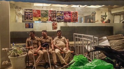 Police personnel guard at the hotel that was vandalised by Shiv Sena (Shinde) workers after comedian Kunal Kamra's remarks on Maharashtra Dy CM Eknath Shinde, in Khar area in Mumbai (PTI) Police personnel guard at the hotel that was vandalised by Shiv Sena (Shinde) workers after comedian Kunal Kamra's remarks on Maharashtra Dy CM Eknath Shinde, in Khar area in Mumbai (PTI)