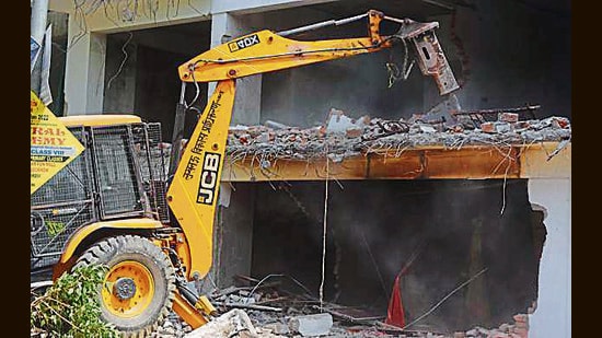 Demolition work underway by LDA at an illegal construction site of Yajdan builder, near Balu Adda, in Lucknow, Uttar Pradesh, India, on Wednesday, March 30, 2022. (Deepak Gupta/Hindustan Times)