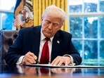 US President Donald Trump signs an executive order in the Oval Office of the White House in Washington, DC, US, on Wednesday, March 26, 2025. US President Donald Trump signs an executive order in the Oval Office of the White House in Washington, DC, US, on Wednesday, March 26, 2025.