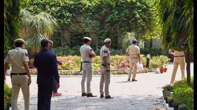 A Delhi Police team led by Deputy Commissioner of Police (New Delhi) arrives at the residence of Delhi High Court Judge Justice Yashwant Varma, in New Delhi. (PTI)