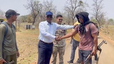 DIG Kamlochan Kashyap (in white) congratulates security personnel on their return after the encounter at Dantewada Bijapur border in Chhattisgarh on Tuesday. (PTI Photo) DIG Kamlochan Kashyap (in white) congratulates security personnel on their return after the encounter at Dantewada Bijapur border in Chhattisgarh on Tuesday. (PTI Photo)