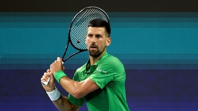 Novak Djokovic of Serbia returns a shot to Lorenzo Musetti of Italy during the Miami Open (Getty Images via AFP) Novak Djokovic of Serbia returns a shot to Lorenzo Musetti of Italy during the Miami Open (Getty Images via AFP)
