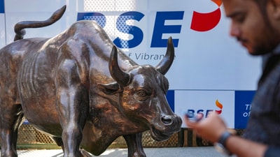 Sensex, Nifty 50 today: A man walks past the bull statue at BSE building in Mumbai. (PTI)