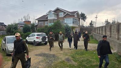 Police conducting a raid in Srinagar in connection with investigation of banned organisations on Wednesday. (HT Photo) Police conducting a raid in Srinagar in connection with investigation of banned organisations on Wednesday. (HT Photo)