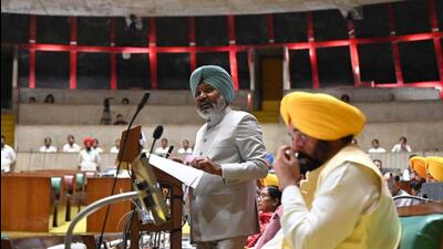 Punjab finance minister Harpal Singh Cheema presenting the budget as chief minister Bhagwant Mann looks on in the Vidhan Sabha in Chandigarh on Wednesday. (Ravi Kumar/HT)