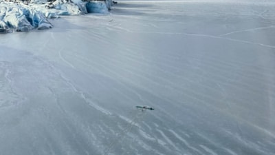 This photo provided by Dale Eicher on Monday, March 24, 2025 shows an airplane partially submerged into the ice of Tustumena Lake near Soldotna, Alaska, with the three survivors standing on the plane's wing. (AP ) This photo provided by Dale Eicher on Monday, March 24, 2025 shows an airplane partially submerged into the ice of Tustumena Lake near Soldotna, Alaska, with the three survivors standing on the plane's wing. (AP )
