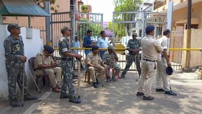 Security personnel at the residence of Chhattisgarh former chief minister Bhupesh Baghel during a CBI raid, in Bhilai on Wednesday. (PTI) Security personnel at the residence of Chhattisgarh former chief minister Bhupesh Baghel during a CBI raid, in Bhilai on Wednesday. (PTI)