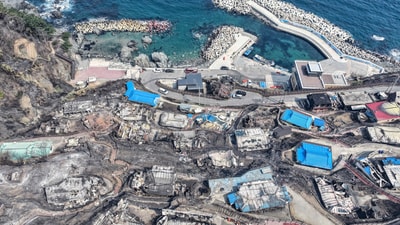 The infernos, which began last Friday, have burned more than 200 buildings, including residences, factories, and an old Buddhist monastery, the National Fire Agency confirmed on Wednesday. In pic: Burnt-out houses are seen in a damaged village due to wildfires in Yeongdeok, South Korea. (AP) The infernos, which began last Friday, have burned more than 200 buildings, including residences, factories, and an old Buddhist monastery, the National Fire Agency confirmed on Wednesday. In pic: Burnt-out houses are seen in a damaged village due to wildfires in Yeongdeok, South Korea. (AP)