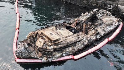A burnt-out fishing boat is seen in a damaged port due to wildfires in Yeongdeok, South Korea. (AP) A burnt-out fishing boat is seen in a damaged port due to wildfires in Yeongdeok, South Korea. (AP)