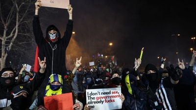 Violent altercations have resulted from riot police using pepper spray, rubber bullets, and water cannons to scatter crowds. Erdogan has called the protests "street terror" and promised to crack down on protesters. In pic: Demonstrators hold placards as people take part in a protest against the arrest of Istanbul Mayor Ekrem Imamoglu. (REUTERS)