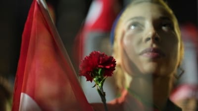 During a meeting with Turkish foreign minister Hakan Fidan in Washington, US secretary of state Marco Rubio voiced concerns about the widespread protests and arrests. Erdogan's government has not backed down in the face of international pressure. In pic: A protester holds a flower as she stands behind police barrier during a protest after Istanbul's Mayor Ekrem Imamoglu was arrested and sent to prison in Istanbul. (AP)