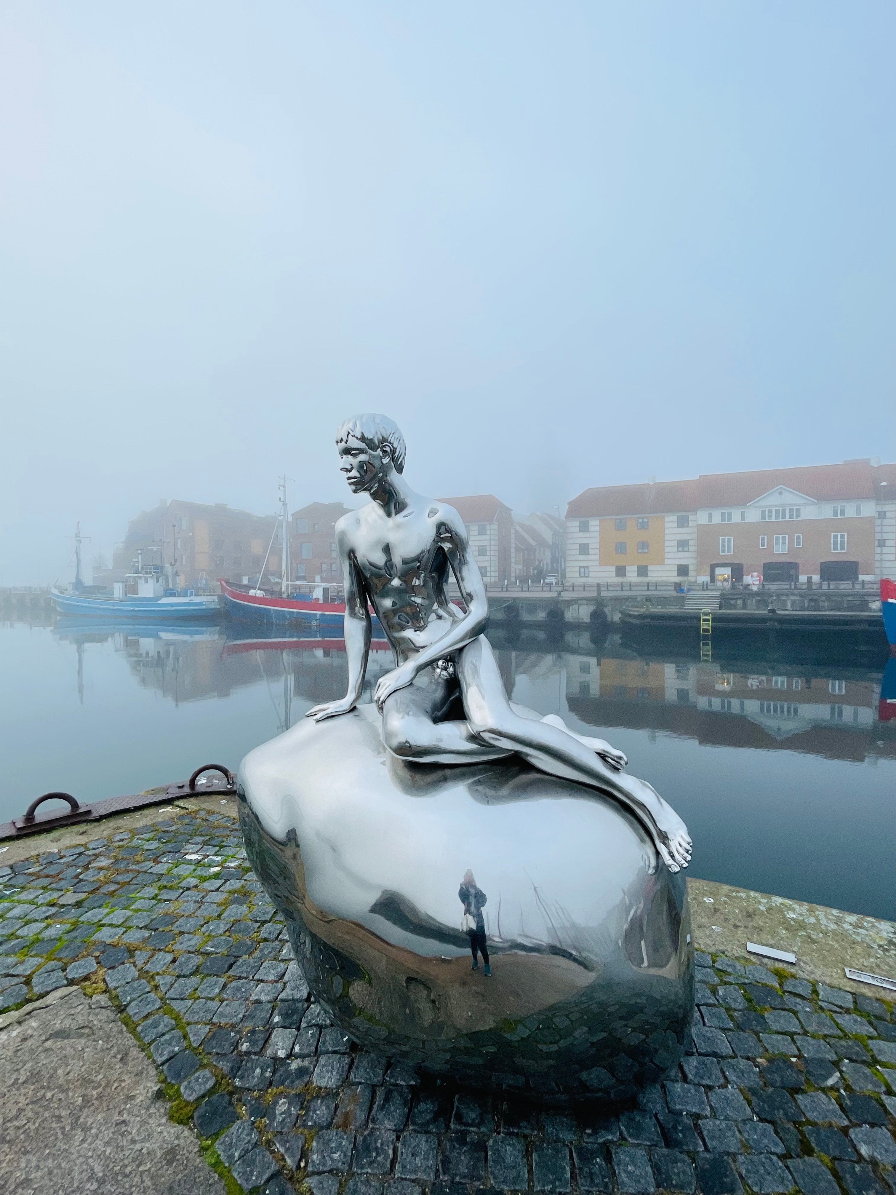 “I walk past the colourful boats and dinghies in the harbour and find myself in front of a polished steel sculpture of a young man sitting in the mermaid pose. Created by Elmgreen & Dragset, Han, which translates into “He” in English, clearly references Edvard Eriksen’s The Little Mermaid sculpture in Copenhagen.” (Wonderful Copenhagen) “I walk past the colourful boats and dinghies in the harbour and find myself in front of a polished steel sculpture of a young man sitting in the mermaid pose. Created by Elmgreen & Dragset, Han, which translates into “He” in English, clearly references Edvard Eriksen’s The Little Mermaid sculpture in Copenhagen.” (Wonderful Copenhagen)