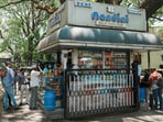 Customers at a Nandini milk shop in Bengaluru.